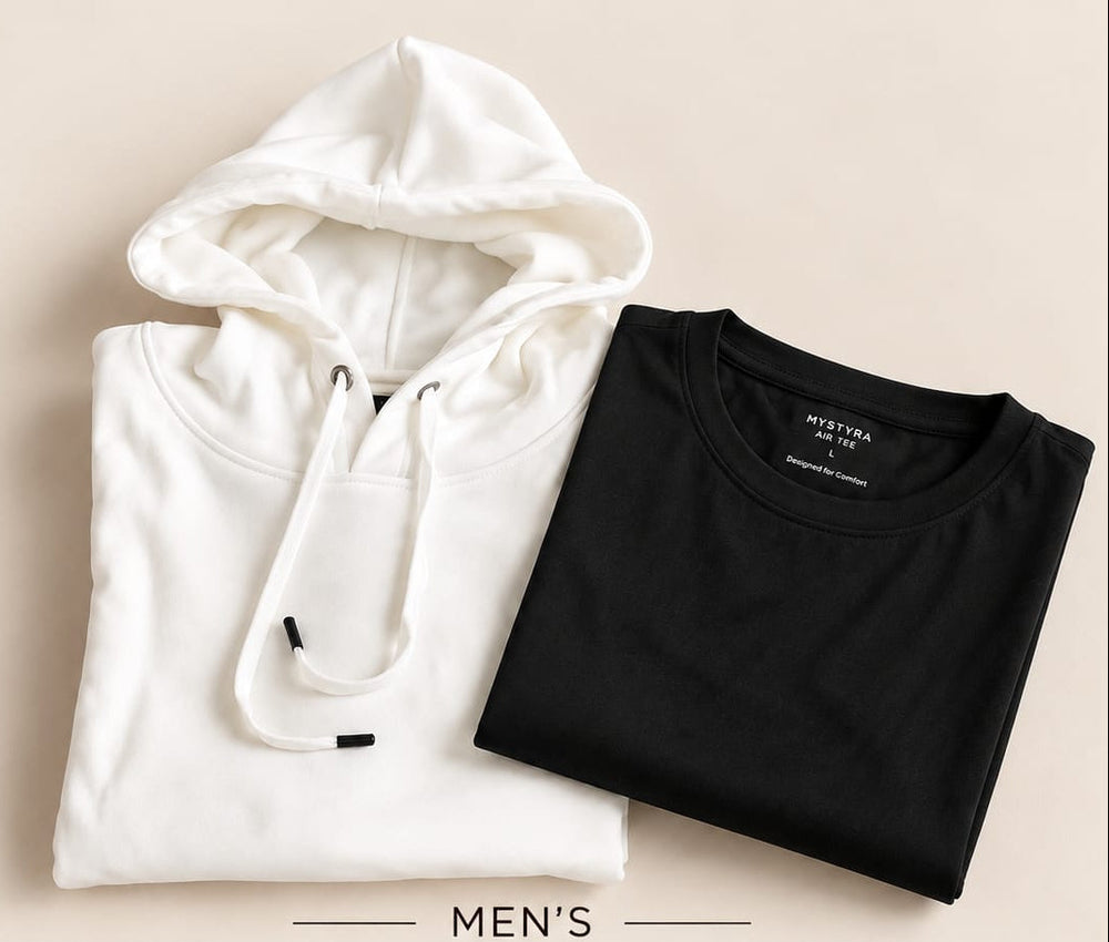 A folded white hoodie and a folded black crew-neck T-shirt are arranged on a light beige background with promotional text below reading 'MEN'S THE SHIFT-TO-STREET SET' and price information.